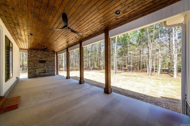 Welcome to your dream lakehouse featuring a boat slip. Enjoy on  in Arkansas - for sale on GolfHomes.com, golf home, golf lot
