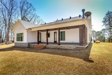Welcome to your dream lakehouse featuring a boat slip. Enjoy on  in Arkansas - for sale on GolfHomes.com, golf home, golf lot
