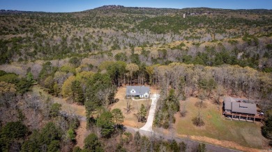 Welcome to your dream lakehouse featuring a boat slip. Enjoy on  in Arkansas - for sale on GolfHomes.com, golf home, golf lot