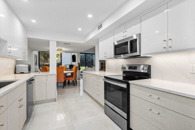 WALK TO EVERYTHING Renovated inside and out, new roofs, fencing on Boca West Golf and Country Club in Florida - for sale on GolfHomes.com, golf home, golf lot