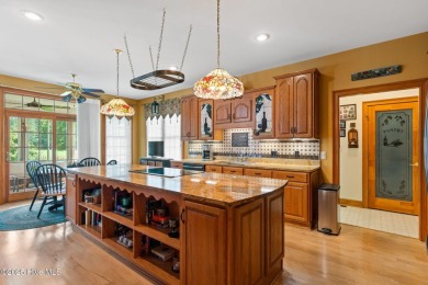 This custom 4-bedroom, 2.5-bath brick home is a true gem on Brunswick Plantation and Golf Resorts in North Carolina - for sale on GolfHomes.com, golf home, golf lot