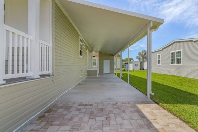 This 2024 Jacobsen Home offering two bedrooms, plus a den, is on Royal Wood Golf and Country Club in Florida - for sale on GolfHomes.com, golf home, golf lot