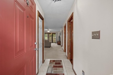 Discover your perfect getaway in this delightful first-floor on Myrtlewood Golf Course and Club  in South Carolina - for sale on GolfHomes.com, golf home, golf lot