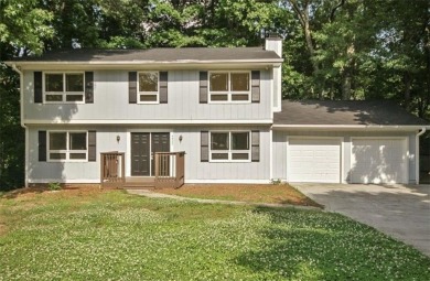 This charming 4-bedroom 3-bath home is perfect for a growing on Hidden Hills Country Club in Georgia - for sale on GolfHomes.com, golf home, golf lot
