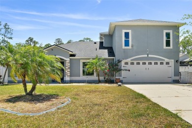 This lovely home is located in the very desirable Cypress Knoll on The Grand Club Cypress Course in Florida - for sale on GolfHomes.com, golf home, golf lot