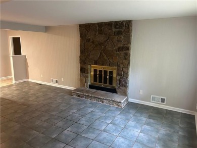 This charming 4-bedroom 3-bath home is perfect for a growing on Hidden Hills Country Club in Georgia - for sale on GolfHomes.com, golf home, golf lot