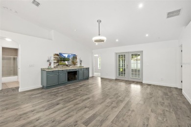 This lovely home is located in the very desirable Cypress Knoll on The Grand Club Cypress Course in Florida - for sale on GolfHomes.com, golf home, golf lot
