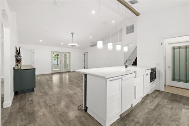 This lovely home is located in the very desirable Cypress Knoll on The Grand Club Cypress Course in Florida - for sale on GolfHomes.com, golf home, golf lot