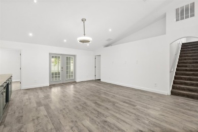 This lovely home is located in the very desirable Cypress Knoll on The Grand Club Cypress Course in Florida - for sale on GolfHomes.com, golf home, golf lot