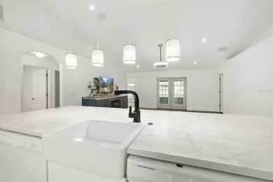 This lovely home is located in the very desirable Cypress Knoll on The Grand Club Cypress Course in Florida - for sale on GolfHomes.com, golf home, golf lot