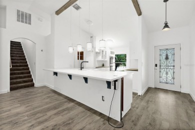 This lovely home is located in the very desirable Cypress Knoll on The Grand Club Cypress Course in Florida - for sale on GolfHomes.com, golf home, golf lot