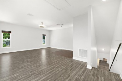 This lovely home is located in the very desirable Cypress Knoll on The Grand Club Cypress Course in Florida - for sale on GolfHomes.com, golf home, golf lot