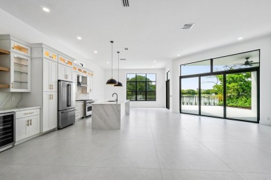 This amazing view complements the beautiful fully renovated 3 on BallenIsles Golf and Country Club in Florida - for sale on GolfHomes.com, golf home, golf lot