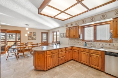 This custom-built home sits on the edge of Walter's Ridge golf on Pheasant Ridge Municipal Golf Course in Iowa - for sale on GolfHomes.com, golf home, golf lot