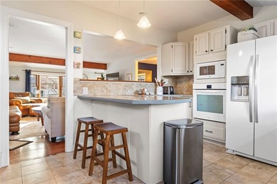 Welcome to 151 Ives Road, a bright and charming 3-bedroom home on Potowomut Golf Club in Rhode Island - for sale on GolfHomes.com, golf home, golf lot