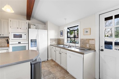 Welcome to 151 Ives Road, a bright and charming 3-bedroom home on Potowomut Golf Club in Rhode Island - for sale on GolfHomes.com, golf home, golf lot