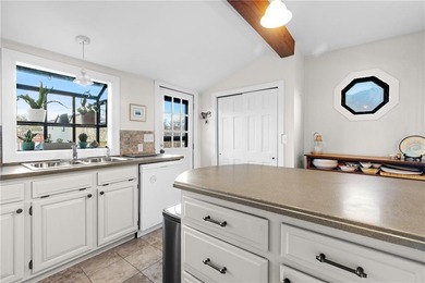 Welcome to 151 Ives Road, a bright and charming 3-bedroom home on Potowomut Golf Club in Rhode Island - for sale on GolfHomes.com, golf home, golf lot