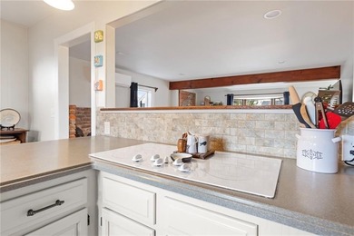 Welcome to 151 Ives Road, a bright and charming 3-bedroom home on Potowomut Golf Club in Rhode Island - for sale on GolfHomes.com, golf home, golf lot