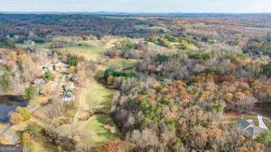 Discover the perfect canvas for your dream home with this on The Orchard Golf and Country Club in Georgia - for sale on GolfHomes.com, golf home, golf lot