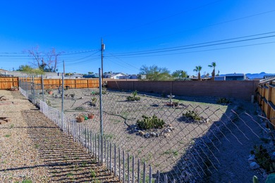 Nestled in a highly desirable central neighborhood, this on London Bridge Golf Course in Arizona - for sale on GolfHomes.com, golf home, golf lot