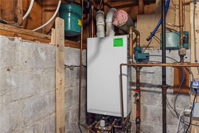 Welcome to 151 Ives Road, a bright and charming 3-bedroom home on Potowomut Golf Club in Rhode Island - for sale on GolfHomes.com, golf home, golf lot