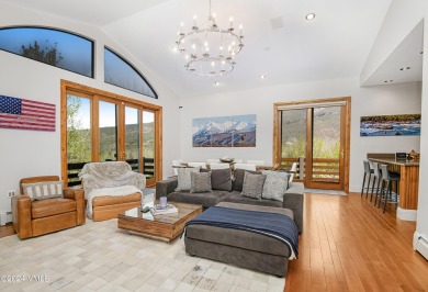 Indulge in breathtaking vistas from the expansive, airy living on Eagle Vail Golf Course in Colorado - for sale on GolfHomes.com, golf home, golf lot