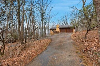 A storybook mountain bungalow offering the gentle ambiance of on Bent Tree Golf Course in Georgia - for sale on GolfHomes.com, golf home, golf lot