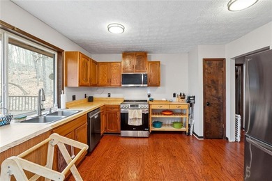 A storybook mountain bungalow offering the gentle ambiance of on Bent Tree Golf Course in Georgia - for sale on GolfHomes.com, golf home, golf lot