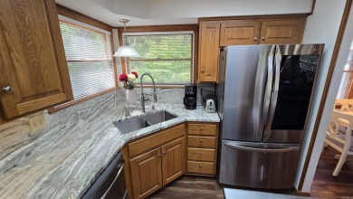 Discover your dream home in the heart of Fairfield Bay's resort on Mountain Ranch Golf Club in Arkansas - for sale on GolfHomes.com, golf home, golf lot
