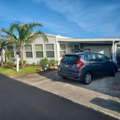 Escape to your own slice of paradise in this charming Beverly on Grand Haven Golf Club in Florida - for sale on GolfHomes.com, golf home, golf lot