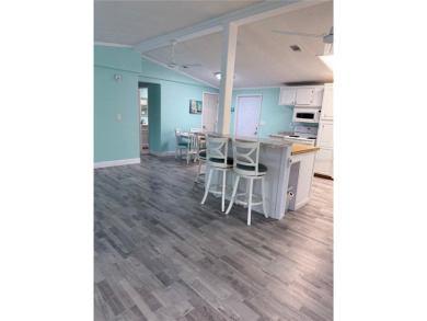 Escape to your own slice of paradise in this charming Beverly on Grand Haven Golf Club in Florida - for sale on GolfHomes.com, golf home, golf lot