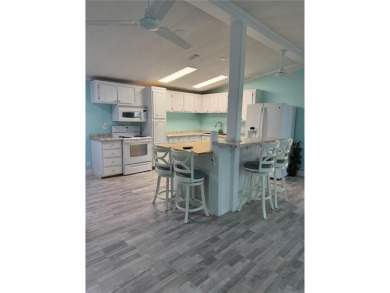 Escape to your own slice of paradise in this charming Beverly on Grand Haven Golf Club in Florida - for sale on GolfHomes.com, golf home, golf lot