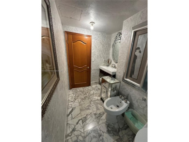 This beautifully classic 2-bedroom, 2-bathroom penthouse at the on Granada Golf Club in Florida - for sale on GolfHomes.com, golf home, golf lot