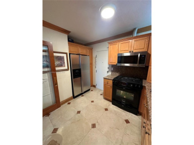 This beautifully classic 2-bedroom, 2-bathroom penthouse at the on Granada Golf Club in Florida - for sale on GolfHomes.com, golf home, golf lot