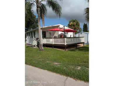 This charming park model home in The Great Outdoors RV  Golf on The Great Outdoors Golf and Country Club in Florida - for sale on GolfHomes.com, golf home, golf lot