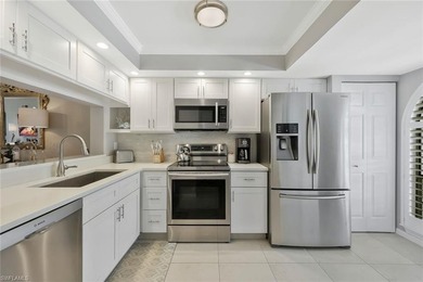 Enjoy elevated living in this beautifully updated two-bedroom on Royal Palm Golf Club in Florida - for sale on GolfHomes.com, golf home, golf lot