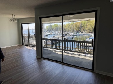 Come home and relax overlooking the water and boats in the cove on Club At Rawls Creek in South Carolina - for sale on GolfHomes.com, golf home, golf lot
