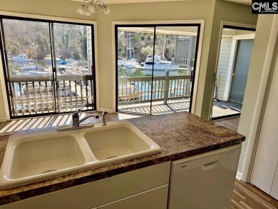 Come home and relax overlooking the water and boats in the cove on Club At Rawls Creek in South Carolina - for sale on GolfHomes.com, golf home, golf lot