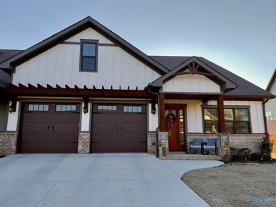 Step into this professionally decorated 3-bedroom, 2-bath home on Gunters Landing in Alabama - for sale on GolfHomes.com, golf home, golf lot