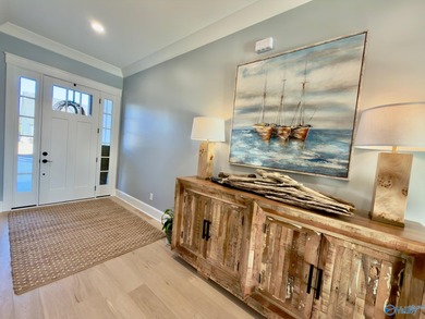 Step into this professionally decorated 3-bedroom, 2-bath home on Gunters Landing in Alabama - for sale on GolfHomes.com, golf home, golf lot