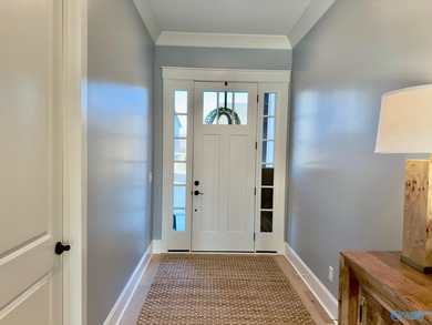 Step into this professionally decorated 3-bedroom, 2-bath home on Gunters Landing in Alabama - for sale on GolfHomes.com, golf home, golf lot