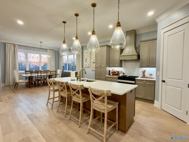 Step into this professionally decorated 3-bedroom, 2-bath home on Gunters Landing in Alabama - for sale on GolfHomes.com, golf home, golf lot