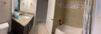 This spacious home is located between two golf courses and two on The Grand Club Cypress Course in Florida - for sale on GolfHomes.com, golf home, golf lot