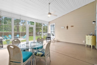 Lush landscaping surrounds this 4-bedroom (One bedroom is on The Founders Club At Pawleys Island in South Carolina - for sale on GolfHomes.com, golf home, golf lot