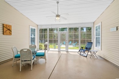 Lush landscaping surrounds this 4-bedroom (One bedroom is on The Founders Club At Pawleys Island in South Carolina - for sale on GolfHomes.com, golf home, golf lot