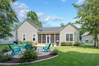 Lush landscaping surrounds this 4-bedroom (One bedroom is on The Founders Club At Pawleys Island in South Carolina - for sale on GolfHomes.com, golf home, golf lot