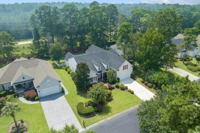 Lush landscaping surrounds this 4-bedroom (One bedroom is on The Founders Club At Pawleys Island in South Carolina - for sale on GolfHomes.com, golf home, golf lot