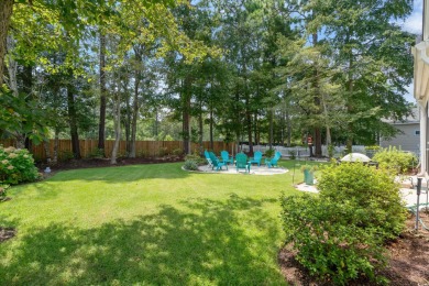 Lush landscaping surrounds this 4-bedroom (One bedroom is on The Founders Club At Pawleys Island in South Carolina - for sale on GolfHomes.com, golf home, golf lot