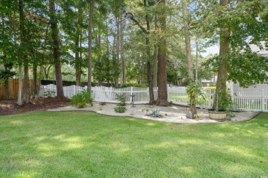 Lush landscaping surrounds this 4-bedroom (One bedroom is on The Founders Club At Pawleys Island in South Carolina - for sale on GolfHomes.com, golf home, golf lot