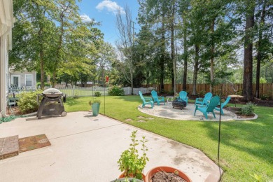 Lush landscaping surrounds this 4-bedroom (One bedroom is on The Founders Club At Pawleys Island in South Carolina - for sale on GolfHomes.com, golf home, golf lot